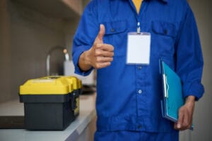 plumbing Abbotsford certified technician fixing burst pipe